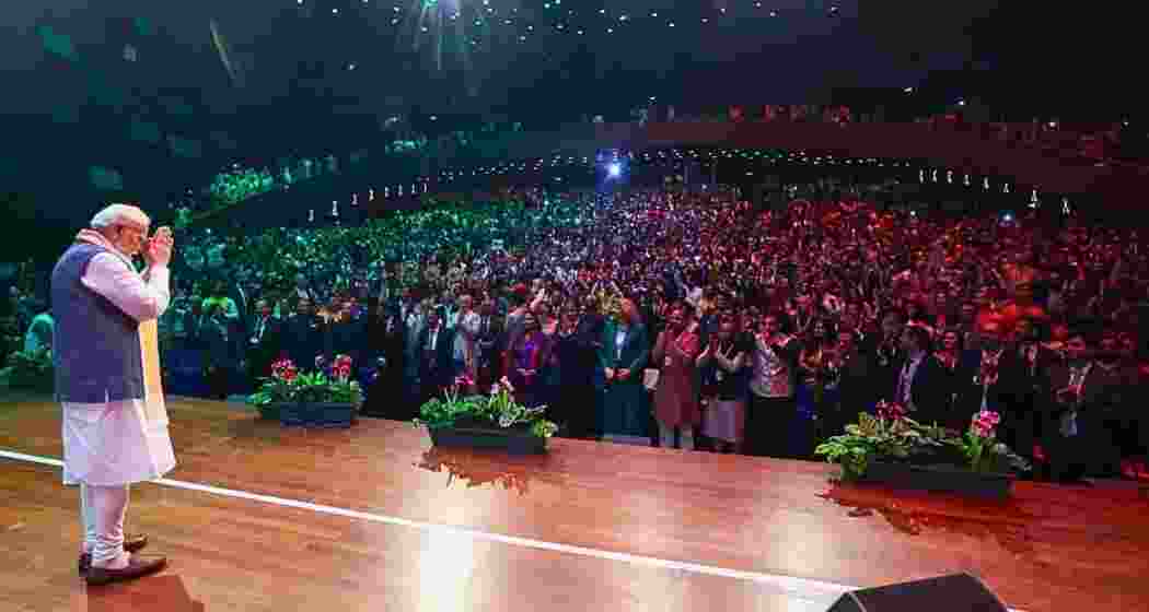 Prime Minister Narendra Modi greets the audience during a community programme, in The Hague, Netherlands. Prime Minister Narendra Modi greets the audience during a community programme, in The Hague, Netherlands.