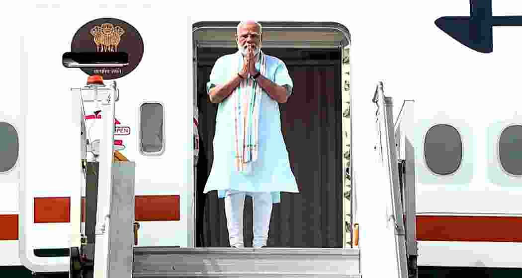Prime Minister Narendra Modi greets supporters after returning to New Delhi following his five-nation tour of the UAE, the Netherlands, Sweden, Norway and Italy, on Thursday. Prime Minister Narendra Modi greets supporters after returning to New Delhi following his five-nation tour of the UAE, the Netherlands, Sweden, Norway and Italy, on Thursday.
