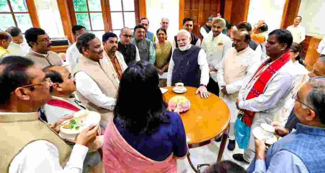 Prime Minister Narendra Modi interacts with Rajya Sabha members during a breakfast meeting at Parliament House in New Delhi on Thursday. Prime Minister Narendra Modi interacts with Rajya Sabha members during a breakfast meeting at Parliament House in New Delhi on Thursday.