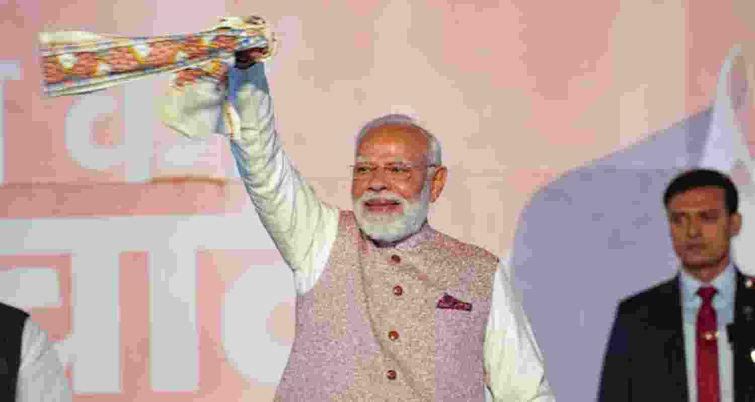 Prime Minister Narendra Modi's gesture towards the party workers and supporters during the victory speech at the BJP headquarters in Delhi on Friday. Prime Minister Narendra Modi's gesture towards the party workers and supporters during the victory speech at the BJP headquarters in Delhi on Friday.