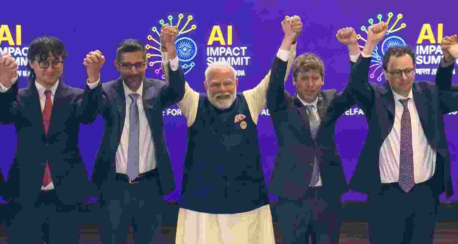 Prime Minister Narendra Modi (C) joins hands with Google CEO Sundar Pichai, OpenAI CEO Sam Altman and others during the India AI Impact Summit 2026, in New Delhi. Prime Minister Narendra Modi (C) joins hands with Google CEO Sundar Pichai, OpenAI CEO Sam Altman and others during the India AI Impact Summit 2026, in New Delhi.