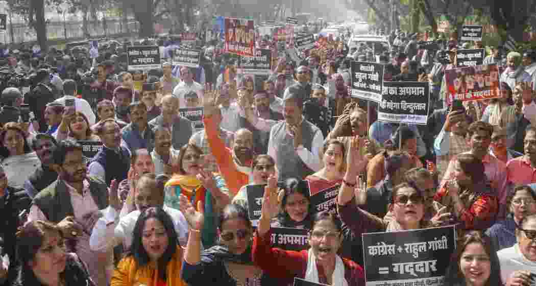 BJP members stage a demonstration over Indian Youth Congress workers' 'shirtless protest' at an AI Impact Summit exhibition hall, in New Delhi on Saturday. BJP members stage a demonstration over Indian Youth Congress workers' 'shirtless protest' at an AI Impact Summit exhibition hall, in New Delhi on Saturday.