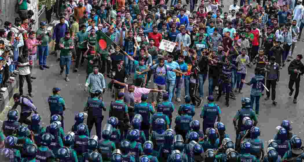 Security personnel confront protesters during anti-quota demonstrations in Dhaka. Security personnel confront protesters during anti-quota demonstrations in Dhaka.