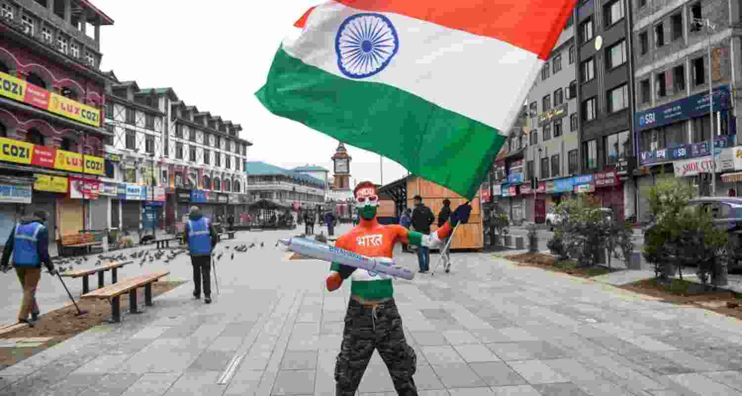 Tourist paints himself in tricolor on R-Day at Lal Chowk Tourist paints himself in tricolor on R-Day at Lal Chowk