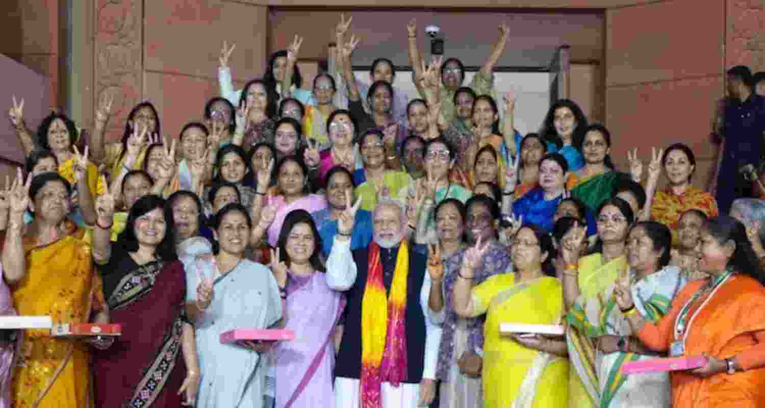 Prime Minister Narendra Modi with women MPs after the Women's Reservation Bill was passed in Rajya Sabha - file image via X. Prime Minister Narendra Modi with women MPs after the Women's Reservation Bill was passed in Rajya Sabha - file image via X.