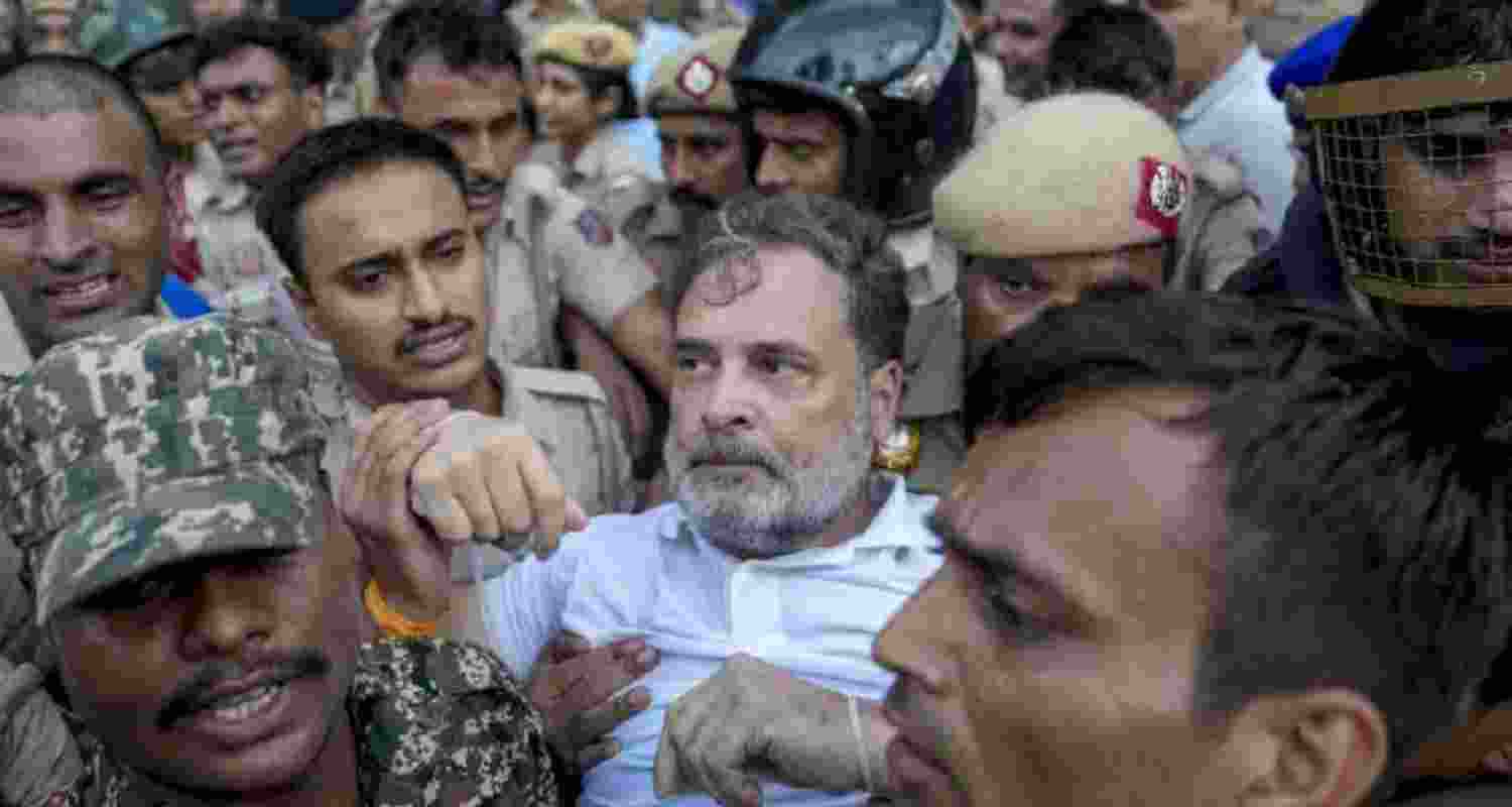 Congress leader Rahul Gandhi being detained by the police during the party's "Chalo PM House" march in New Delhi on Tuesday. Congress leader Rahul Gandhi being detained by the police during the party's "Chalo PM House" march in New Delhi on Tuesday.