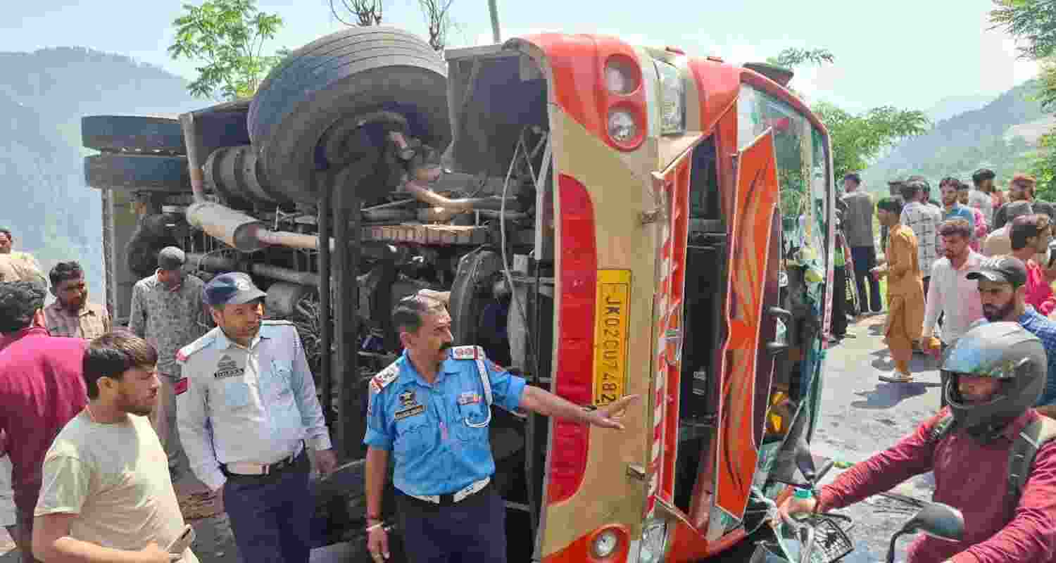Rescue teams and locals at the spot after a passenger bus turned turtle near Sangaldan in Ramban. Rescue teams and locals at the spot after a passenger bus turned turtle near Sangaldan in Ramban.