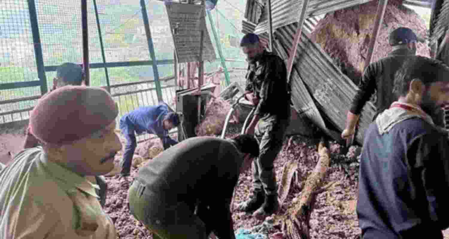 Restoration work underway after a landslide struck the old track to the Vaishno Devi shrine in Jammu and Kashmir on Monday. Restoration work underway after a landslide struck the old track to the Vaishno Devi shrine in Jammu and Kashmir on Monday.