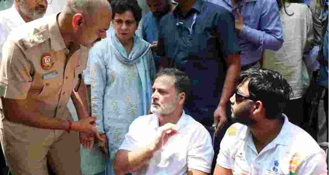 Rahul Gandhi with Sahil Lochab, one of the victims of the reported use of pellet guns during the July 20 protest, at a sit-in outside the Parliament Street Police Station. Rahul Gandhi with Sahil Lochab, one of the victims of the reported use of pellet guns during the July 20 protest, at a sit-in outside the Parliament Street Police Station.
