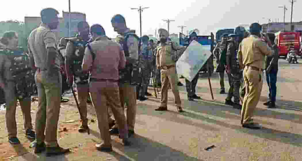 Security personnel at the site of the highway blockade following protests over the BJP's Datia Assembly bypoll candidate. Security personnel at the site of the highway blockade following protests over the BJP's Datia Assembly bypoll candidate.