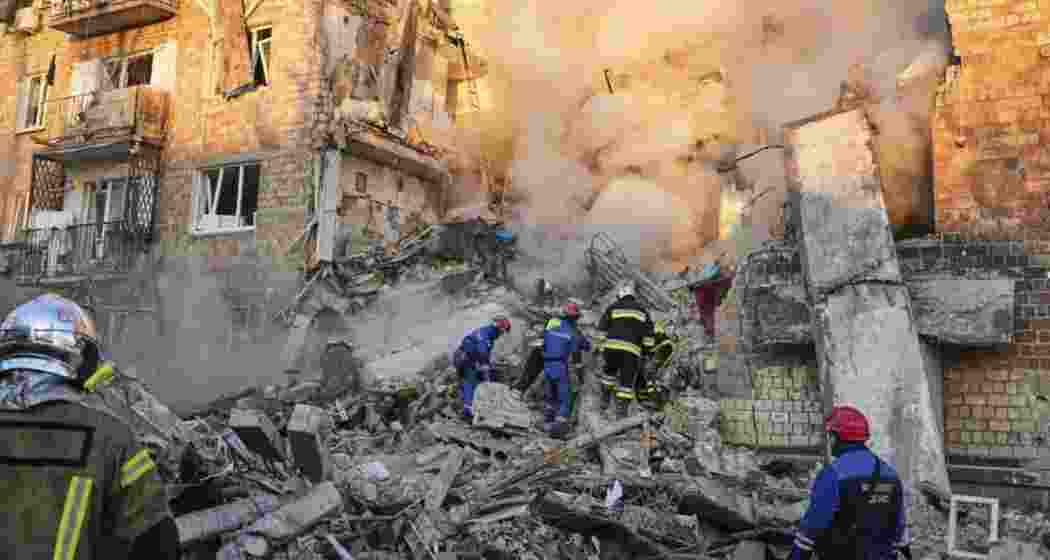 Firefighters engaged in rescue work at a burning building after a Russian attack in Kyiv, Ukraine. Firefighters engaged in rescue work at a burning building after a Russian attack in Kyiv, Ukraine.