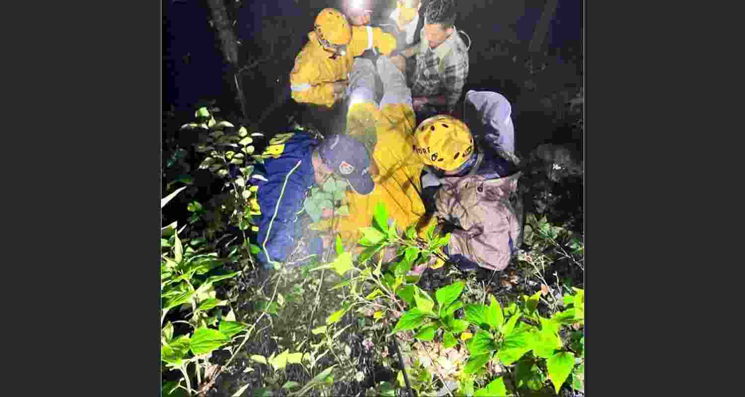 SDRF personnel rescue two injured passengers after their car plunged into a gorge in Nainital district. SDRF personnel rescue two injured passengers after their car plunged into a gorge in Nainital district.