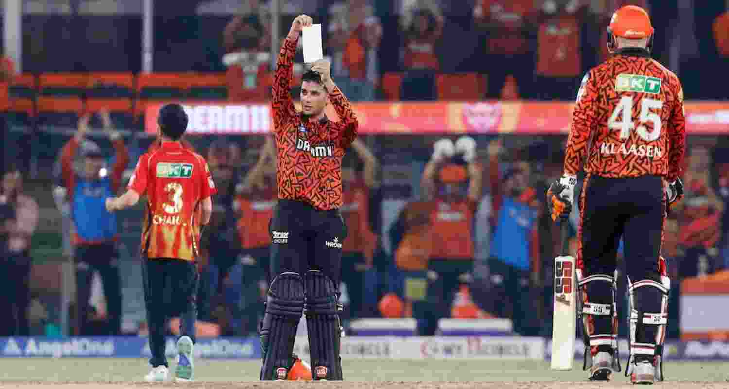 Opener Abhishek Sharma flashing a handwritten note after smashing a sensational century against Punjab Kings. Opener Abhishek Sharma flashing a handwritten note after smashing a sensational century against Punjab Kings.