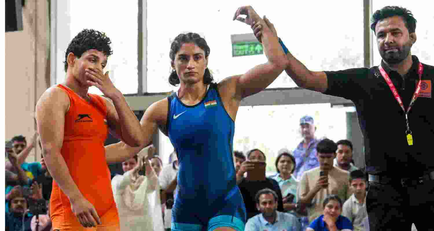 Vinesh Phogat (in blue) won the 53kg category match against Nishu during the Asian Games selection trials in New Delhi on Saturday before losing to Meenakshi Goyat 4-6 in the semifinal. Vinesh Phogat (in blue) won the 53kg category match against Nishu during the Asian Games selection trials in New Delhi on Saturday before losing to Meenakshi Goyat 4-6 in the semifinal.