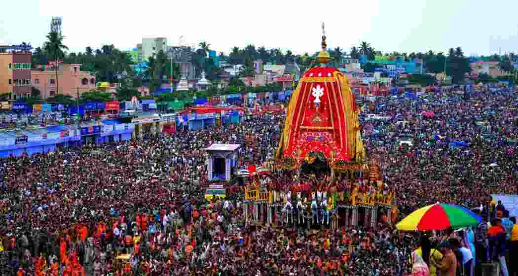 The number of pilgrims continued to swell around the three sacred chariots with lakhs of devotees lining the Grand Road to witness the Rath Yatra in Puri on Thursday. The number of pilgrims continued to swell around the three sacred chariots with lakhs of devotees lining the Grand Road to witness the Rath Yatra in Puri on Thursday.