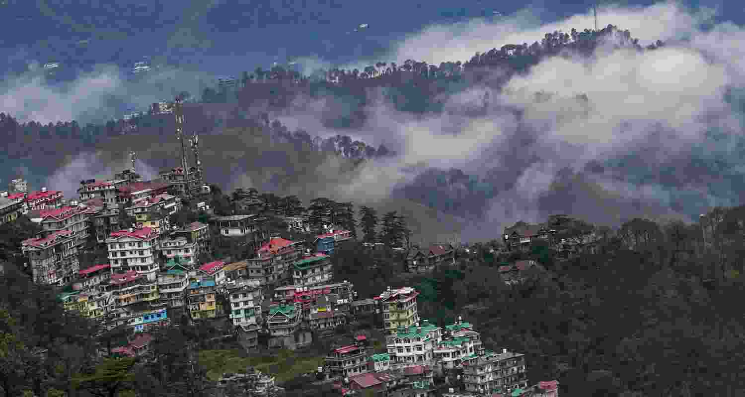 Clouds hover over the hills after rainfall, in Shimla, Himachal Pradesh on Saturday. Clouds hover over the hills after rainfall, in Shimla, Himachal Pradesh on Saturday.