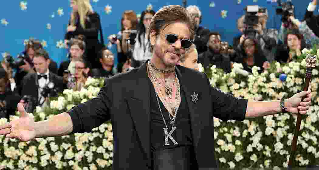 Shah Rukh Khan strikes his signature arms-stretched pose during his debut appearance at the Met Gala 2025 in New York Shah Rukh Khan strikes his signature arms-stretched pose during his debut appearance at the Met Gala 2025 in New York