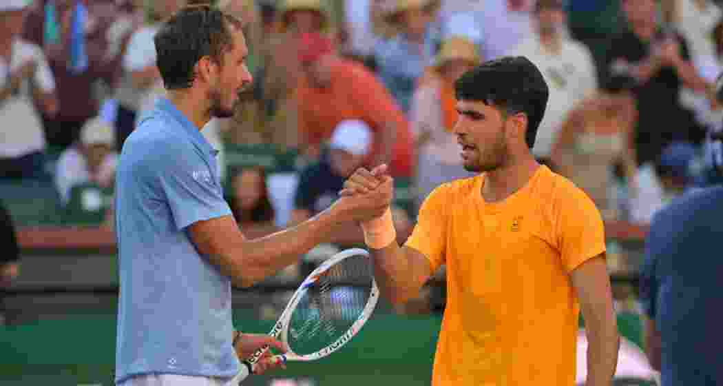 Daniil Medvedev and Carlos Alcaraz. Daniil Medvedev and Carlos Alcaraz.