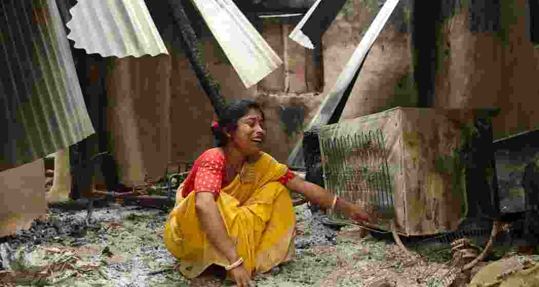 A woman inside her home which was damaged by violence following the death of a tribal youth prior to the panchayat elections. A woman inside her home which was damaged by violence following the death of a tribal youth prior to the panchayat elections.