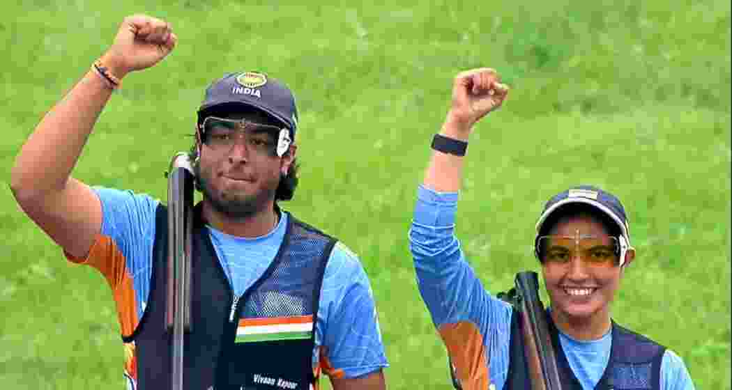 Neeru Dhanda (R) and Vivaan Kapoor celebrate after winning bronze in the trap mixed team event at the ISSF World Cup Shotgun in Almaty on Sunday. Neeru Dhanda (R) and Vivaan Kapoor celebrate after winning bronze in the trap mixed team event at the ISSF World Cup Shotgun in Almaty on Sunday.