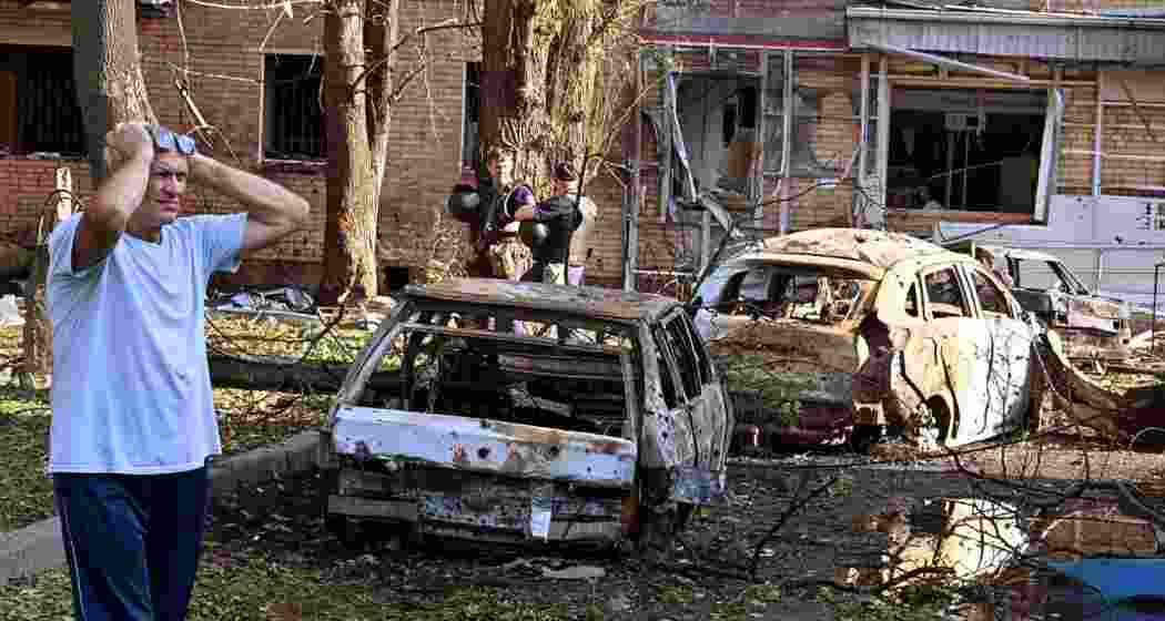 A man stands next to the burnt-out remains of cars in the courtyard of a multi-storey residential building, which, according to local authorities, was struck by an Ukrainian missile during the Russia-Ukraine conflict in Kursk, Russia. File photo. A man stands next to the burnt-out remains of cars in the courtyard of a multi-storey residential building, which, according to local authorities, was struck by an Ukrainian missile during the Russia-Ukraine conflict in Kursk, Russia. File photo.