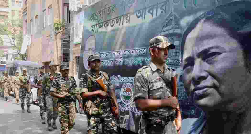 Security personnel conduct a flag march ahead of Assembly elections in West Bengal. The number of polling phases will depend on the availability of central armed police forces. (PTI Photo) Security personnel conduct a flag march ahead of Assembly elections in West Bengal. The number of polling phases will depend on the availability of central armed police forces. (PTI Photo)