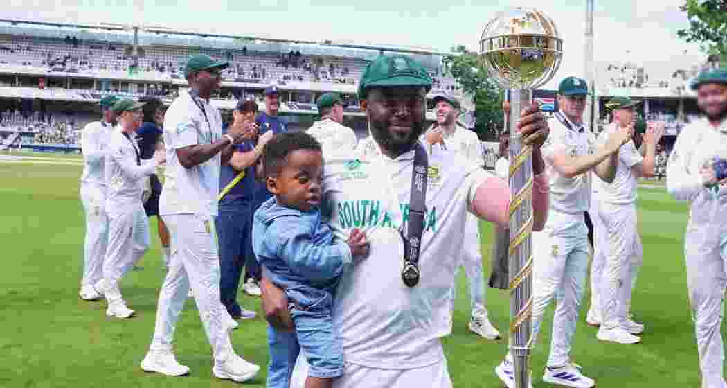 South Africa's captain Temba Bavuma holds the winner's trophy after their win in the World Test Championship against Australia at Lord's cricket ground in London on Saturday. South Africa's captain Temba Bavuma holds the winner's trophy after their win in the World Test Championship against Australia at Lord's cricket ground in London on Saturday.