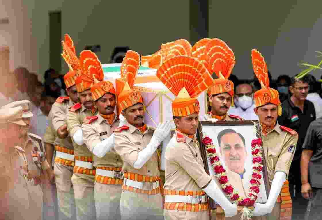 Police personnel carry the mortal remains of former Gujarat chief minister Vijay Rupani for a wreath-laying ceremony in Ahmedabad after the Air India AI171 crash that killed 260 people on June 12, 2025. File photo. Police personnel carry the mortal remains of former Gujarat chief minister Vijay Rupani for a wreath-laying ceremony in Ahmedabad after the Air India AI171 crash that killed 260 people on June 12, 2025. File photo.
