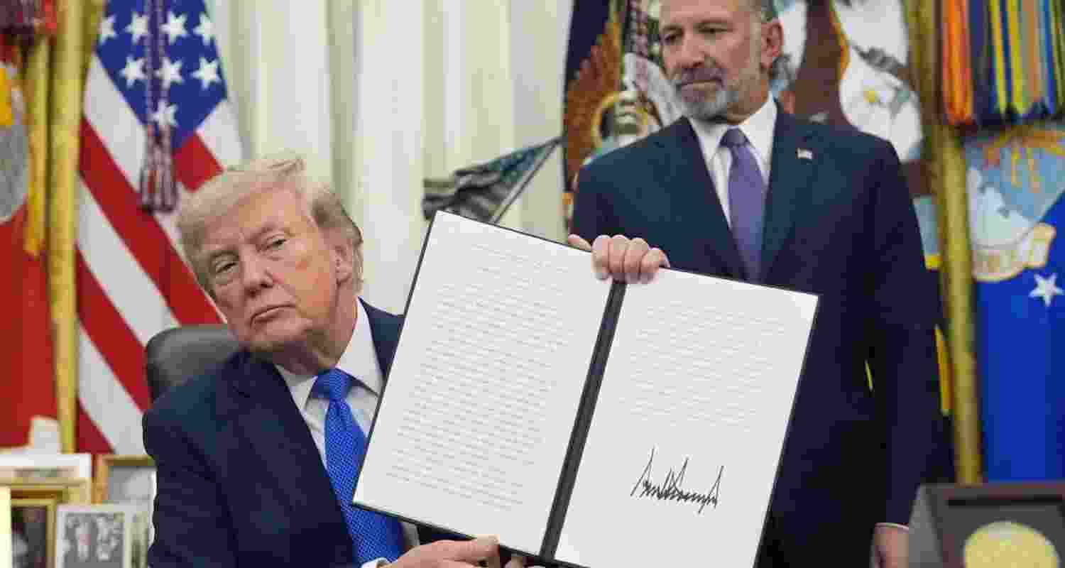 President Donald Trump holds a signed proclamation regarding polysilicon imports in the Oval Office of the White House on Thursday. President Donald Trump holds a signed proclamation regarding polysilicon imports in the Oval Office of the White House on Thursday.