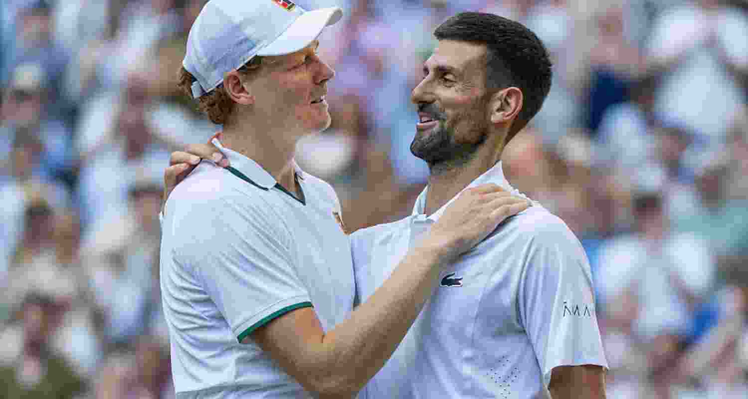 Defending champion Jannik Sinner with Novak Djokovic after the match. Defending champion Jannik Sinner with Novak Djokovic after the match.